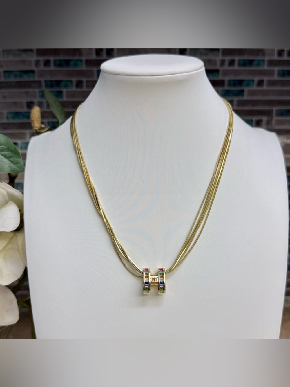 Beautiful gold tone rainbow baguette gemstone necklace